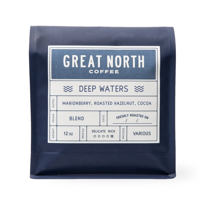 Deep Waters bag from Great North Coffee in navy packaging with the Deep Waters label and marionberry roasted hazelnut cocoa notes