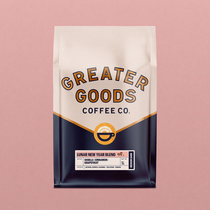Lunar New Year Blend coffee bag with bottom label detailing notes and origin on cream and navy packaging against pink background