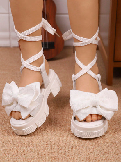 1 Pair New Summer Fashion High Heel Sandals, Designed For Girls, With Soft And Thick Soles, Decorated With Bow Tie. Lace-Up Design To Prevent Slipping Off. Suitable For Princesses Aged 3-15 To Wear On