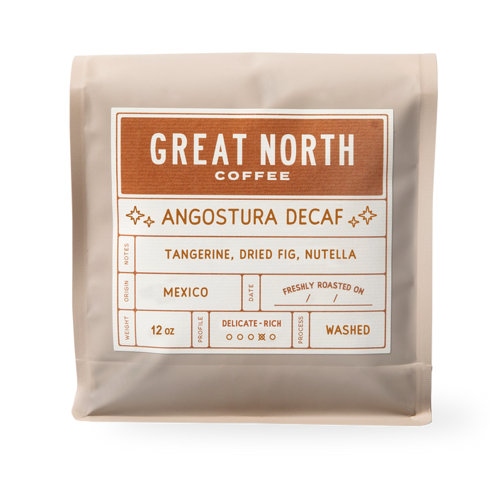 Great North Coffee Angostura Decaf bag label showing Chiapas Mexico origin and tasting notes Tangerine Dried Fig Nutella