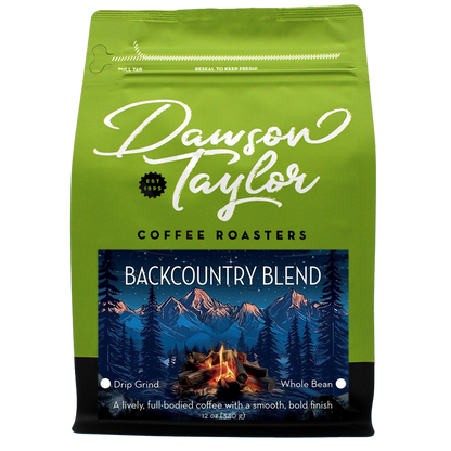 Backcountry Blend coffee bag with a mountains and campfire label on bright green packaging.