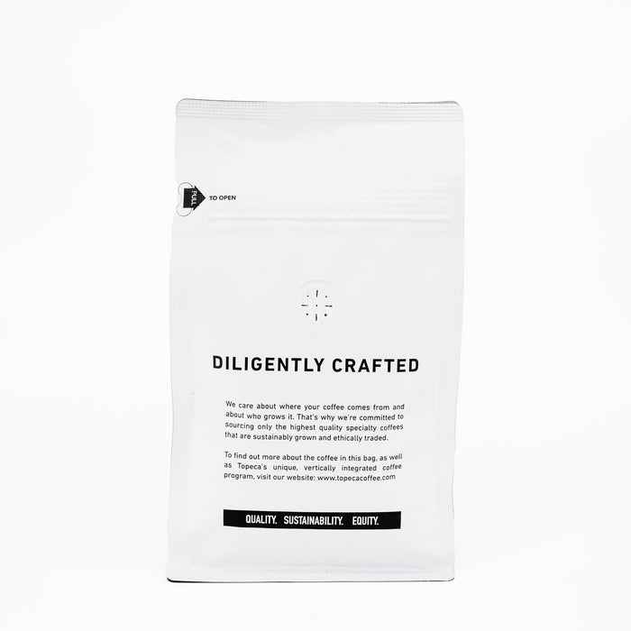 Topeca Breakfast Blend bag featuring DILIGENTLY CRAFTED and a black banner with QUALITY SUSTAINABILITY EQUITY.