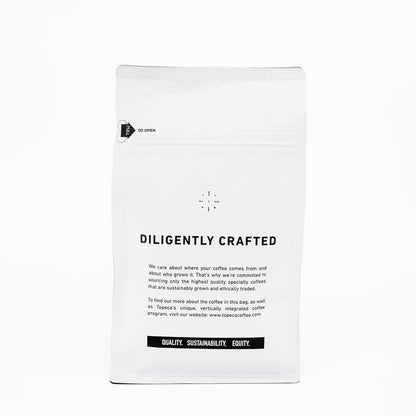 Topeca Breakfast Blend bag featuring DILIGENTLY CRAFTED and a black banner with QUALITY SUSTAINABILITY EQUITY.