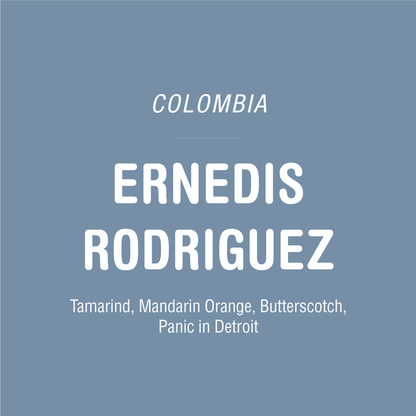 Colombia Ernedis Rodriguez Field Blend coffee cover with bold white text on a blue gray background.