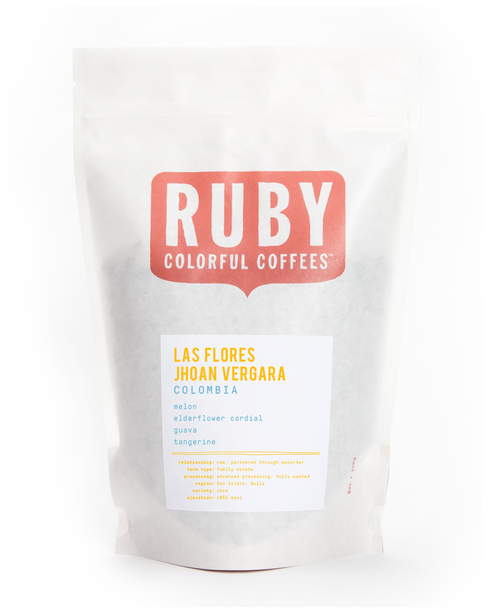 White coffee bag featuring Ruby Colorful Coffees logo and Las Flores Jhoan Vergara Colombia label