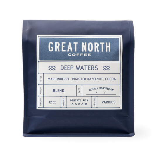 Deep Waters bag from Great North Coffee in navy packaging with the Deep Waters label and marionberry roasted hazelnut cocoa notes