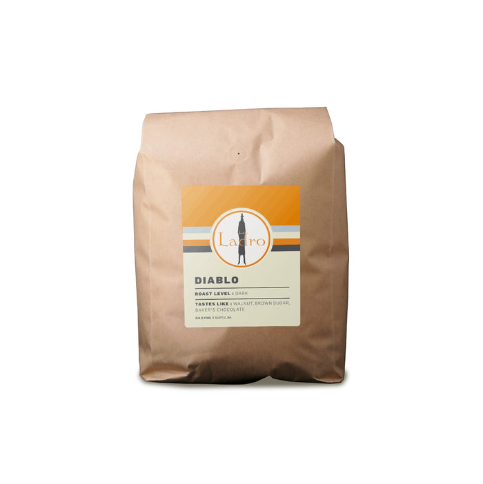 Diablo coffee bag with an orange top and a circular Ladro logo on the front label
