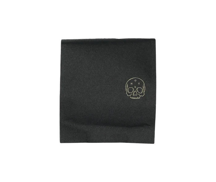 Onyx Eclipse dark roast coffee bag with a gold skull logo on black packaging