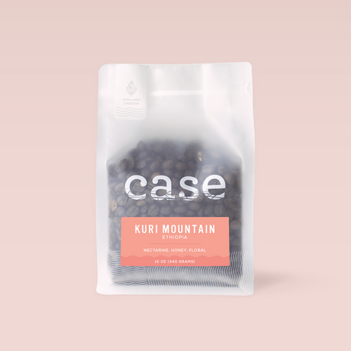 Ethiopia Kuri Mountain coffee bag from Case Coffee Roasters on a soft pink background