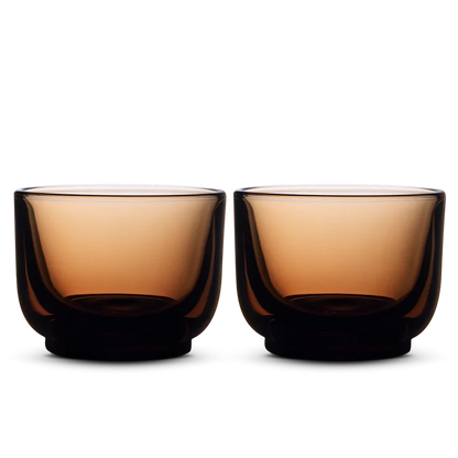 Pair of copper amber Fellow Pirch espresso shot glasses side by side