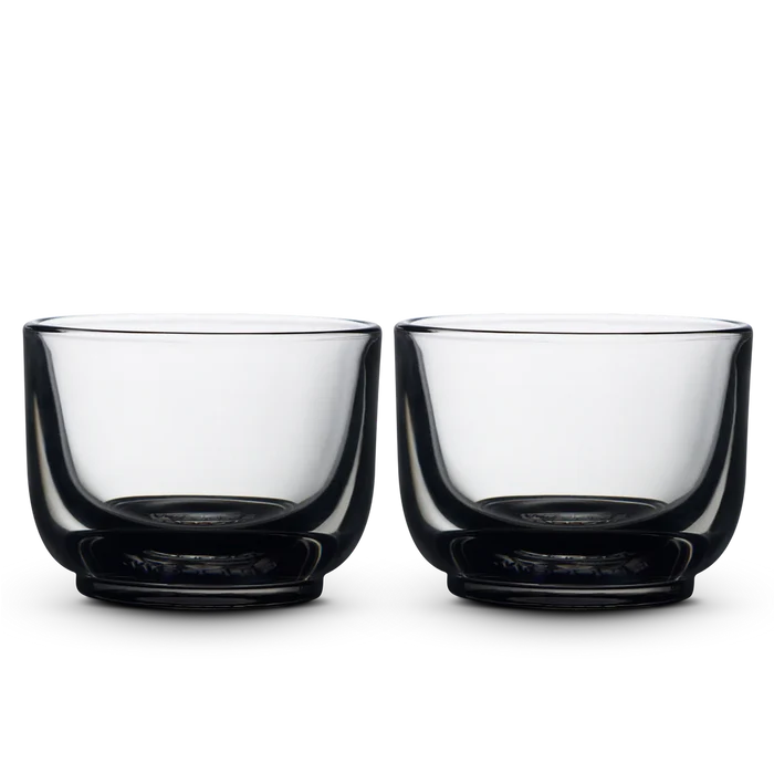 Pair of Fellow Pirch espresso shot glasses with clear bowls and dark bases