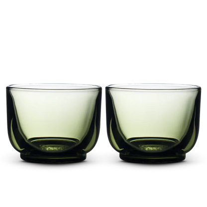 Pair of Fellow Pirch espresso shot glasses with green tinted bowls and dark bases
