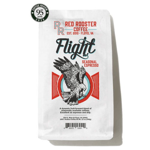 Flight Seasonal Espresso bag with bold Flight branding and a colorful rooster illustration plus a Coffee Review badge.