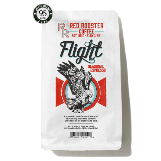Flight Seasonal Espresso bag with bold Flight branding and a colorful rooster illustration plus a Coffee Review badge.