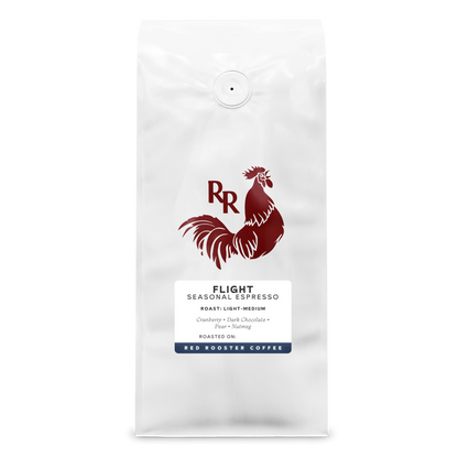 Flight Seasonal Espresso coffee bag with a red rooster logo on white packaging