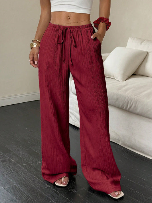 Flirla Women's Casual Solid Color Textured Fabric Knotted Waist Slant Pocket Wide Leg Pants Fall Cloth For Women