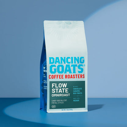 Flow State Omniroast bag from Dancing Goats Coffee Roasters on a blue background