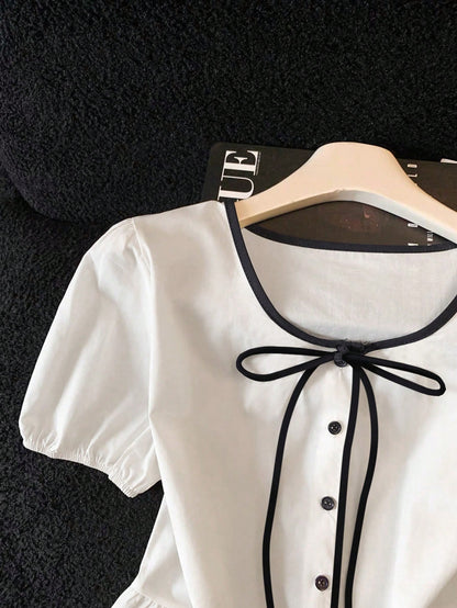 Franclia White And Black Elegant Tea Party Brunch Summer Gentle Cream-White Cinched Waist Blouse,Contrast Trim+Bow Tie,Puff Sleeves,Ruffle Hem Skirt,Soft Top