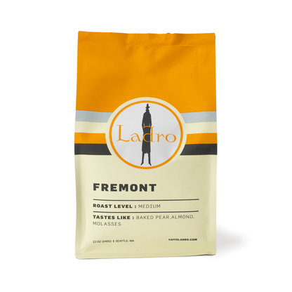 Ladro Fremont coffee bag with an orange top and circular logo on the label