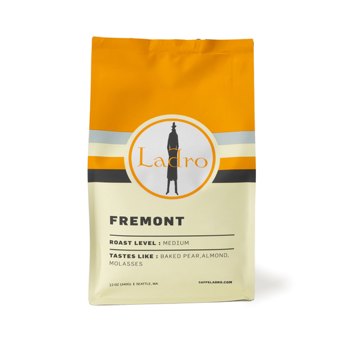Ladro Fremont coffee bag with an orange top and circular logo on the label