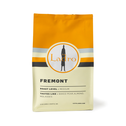 Ladro Fremont coffee bag with an orange top and circular logo on the label