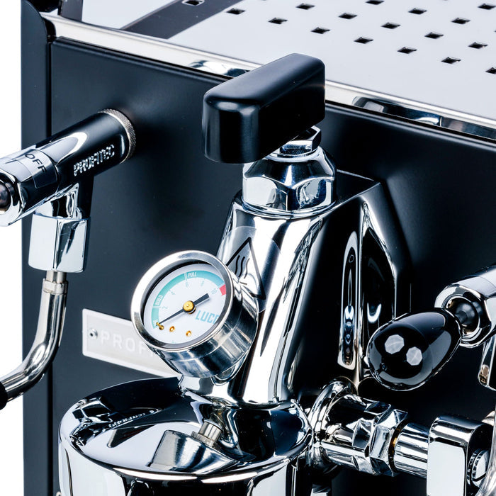 Close up of LUCCA stainless steel flow control with black mushroom knob and visible pressure gauge on espresso machine