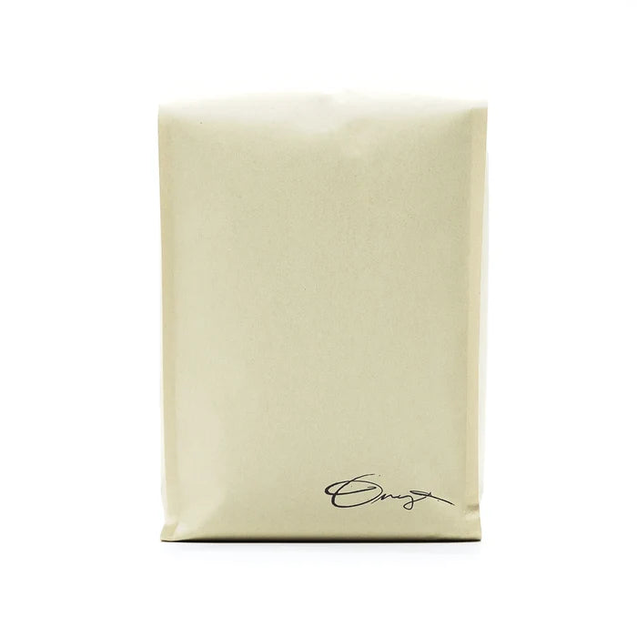 Monarch coffee bag in light kraft with handwritten signature at the bottom