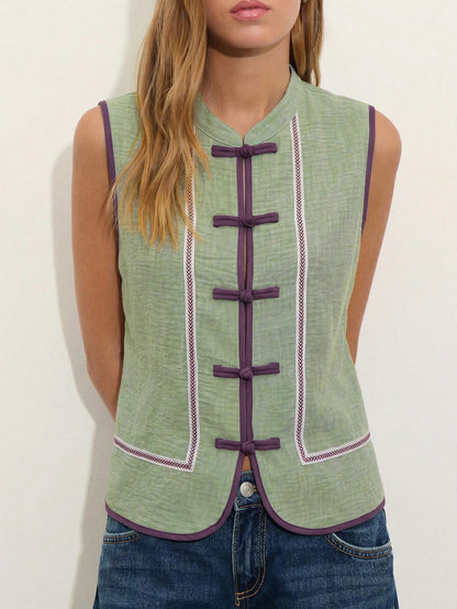 Nöista Sleeveless Top In A Soft Chambray-Blue Tone With Mandarin Collar And Chinese Button Front.Contrast Purple Trim Decorative Piping, Everyday Styling.