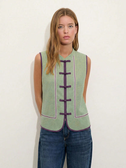 Nöista Sleeveless Top In A Soft Chambray-Blue Tone With Mandarin Collar And Chinese Button Front.Contrast Purple Trim Decorative Piping, Everyday Styling.