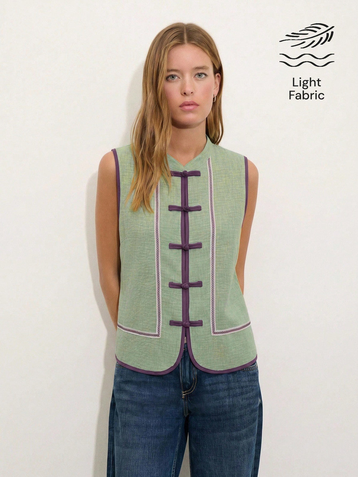 Nöista Sleeveless Top In A Soft Chambray-Blue Tone With Mandarin Collar And Chinese Button Front.Contrast Purple Trim Decorative Piping, Everyday Styling.