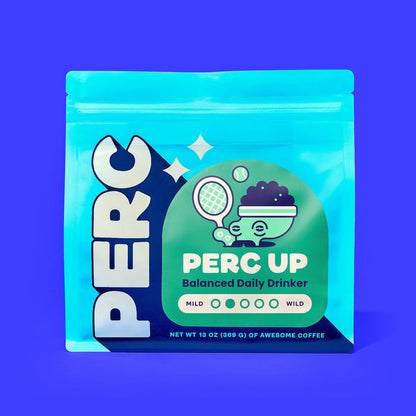 PERC UP Balanced Daily Drinker coffee bag with a green round label and whimsical illustration on purple background