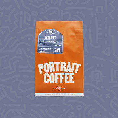 Orange Stacey coffee bag from Portrait Coffee featuring a blue Stacey label and Colombia origin.