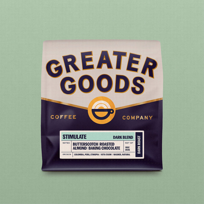 Greater Goods Stimulate Dark Blend coffee bag with bold label and notes of butterscotch and roasted almond