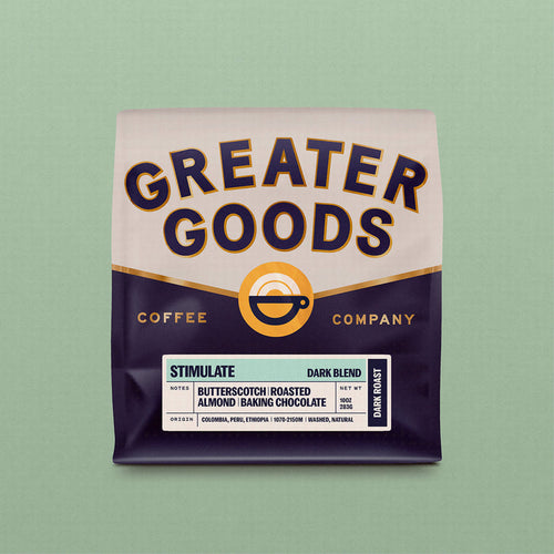 Greater Goods Stimulate Dark Blend coffee bag with bold label and notes of butterscotch and roasted almond