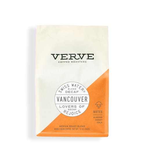Vancouver Swiss Water Decaf whole bean coffee bag with white upper portion and orange diagonal panel and Vancouver seal